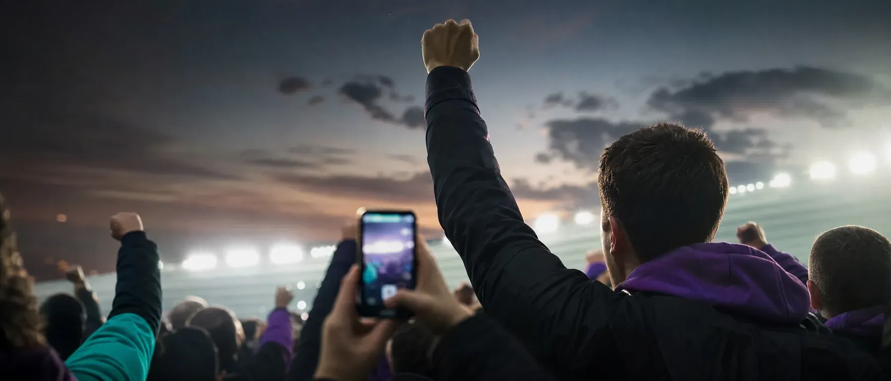Supporters au stade le soir, avant un pari sportif chez bwin